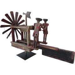 Whirligig with Propeller and Two Men in Hats Pumping