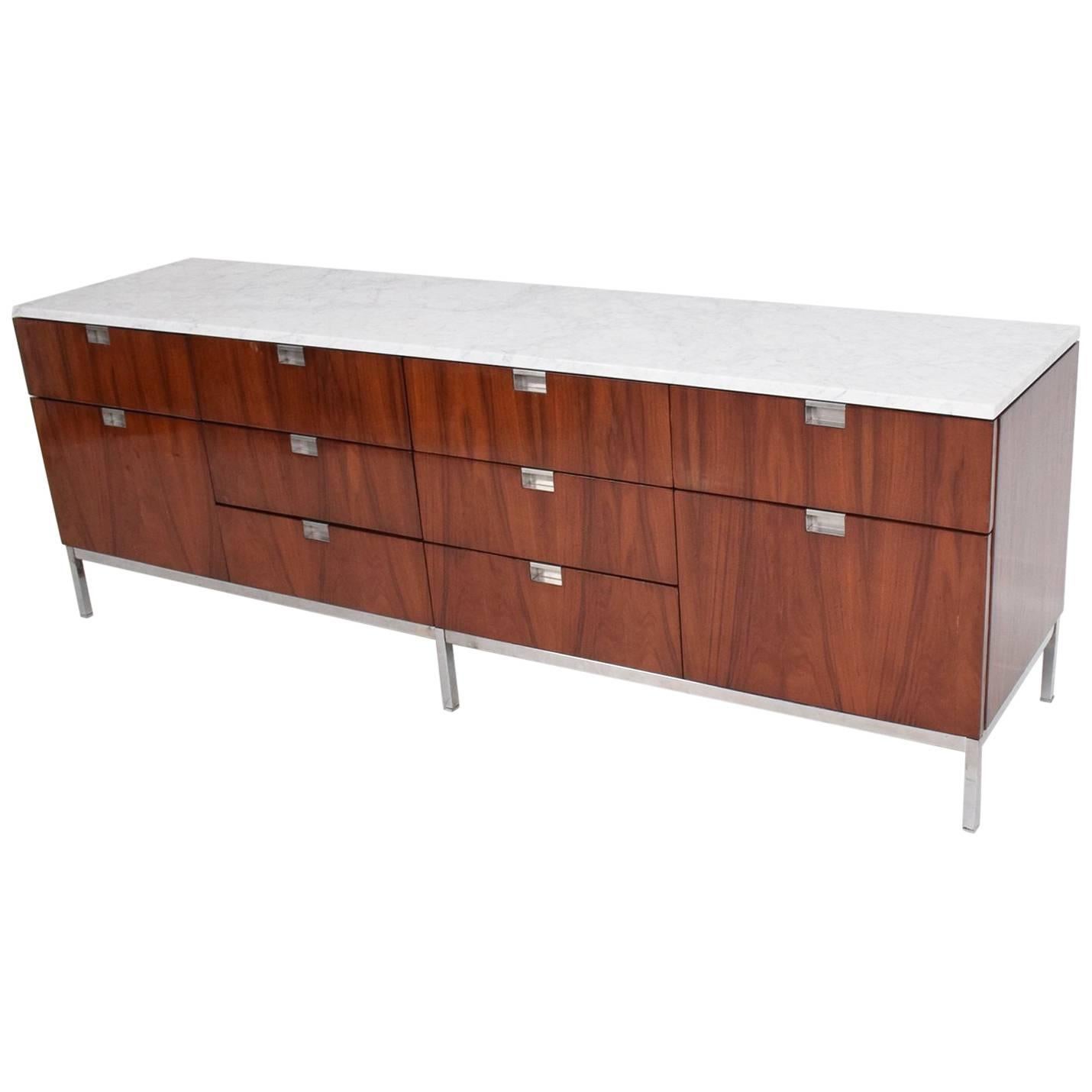 For your consideration a beautiful rosewood credenza designed by Florence Knoll with marble top.

Features (8) eight small pull out drawers and (2) two large file drawers. 
Chrome base has some vintage pitting/patina. 
All drawers open and close