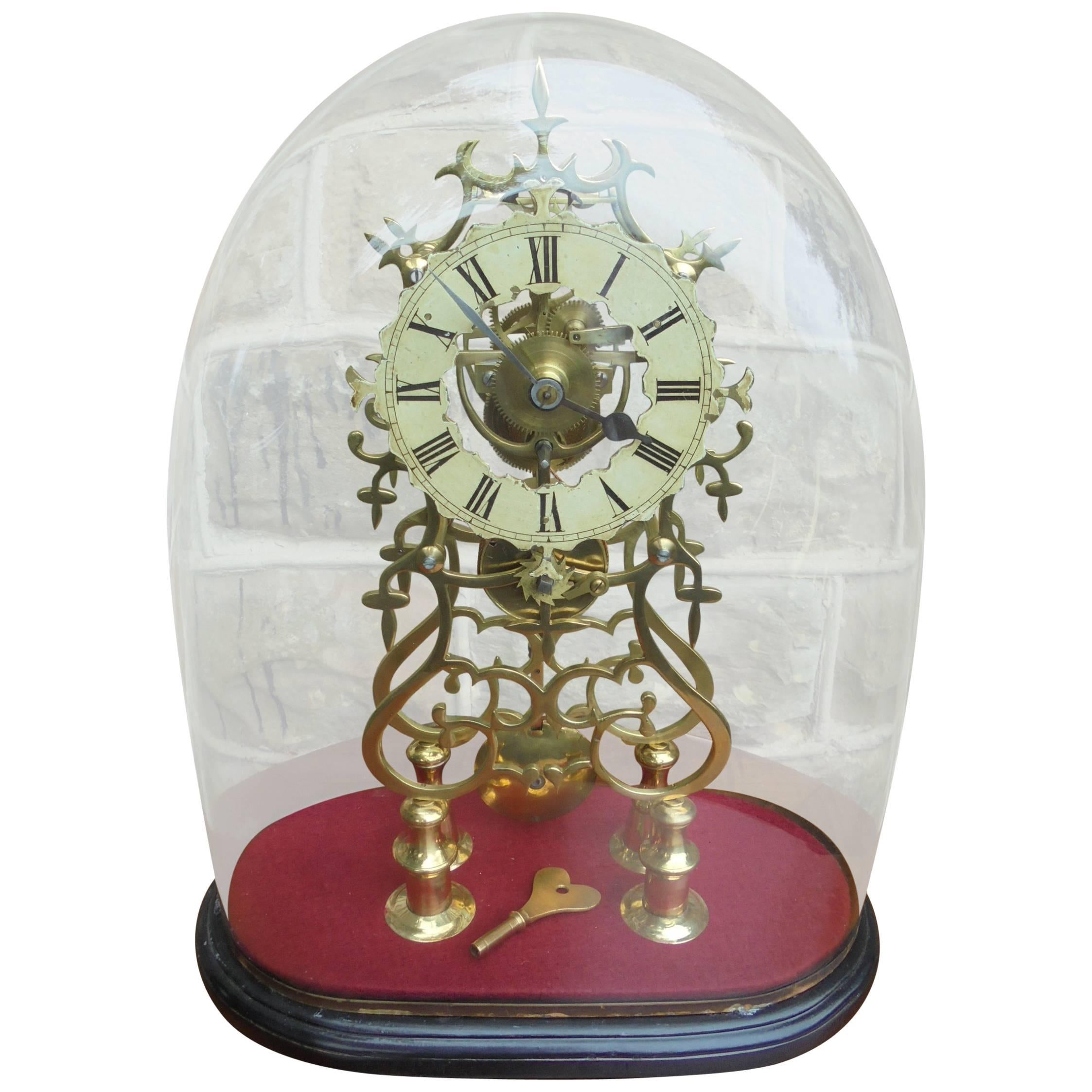 Antique Skeleton Clock under Glass Dome
