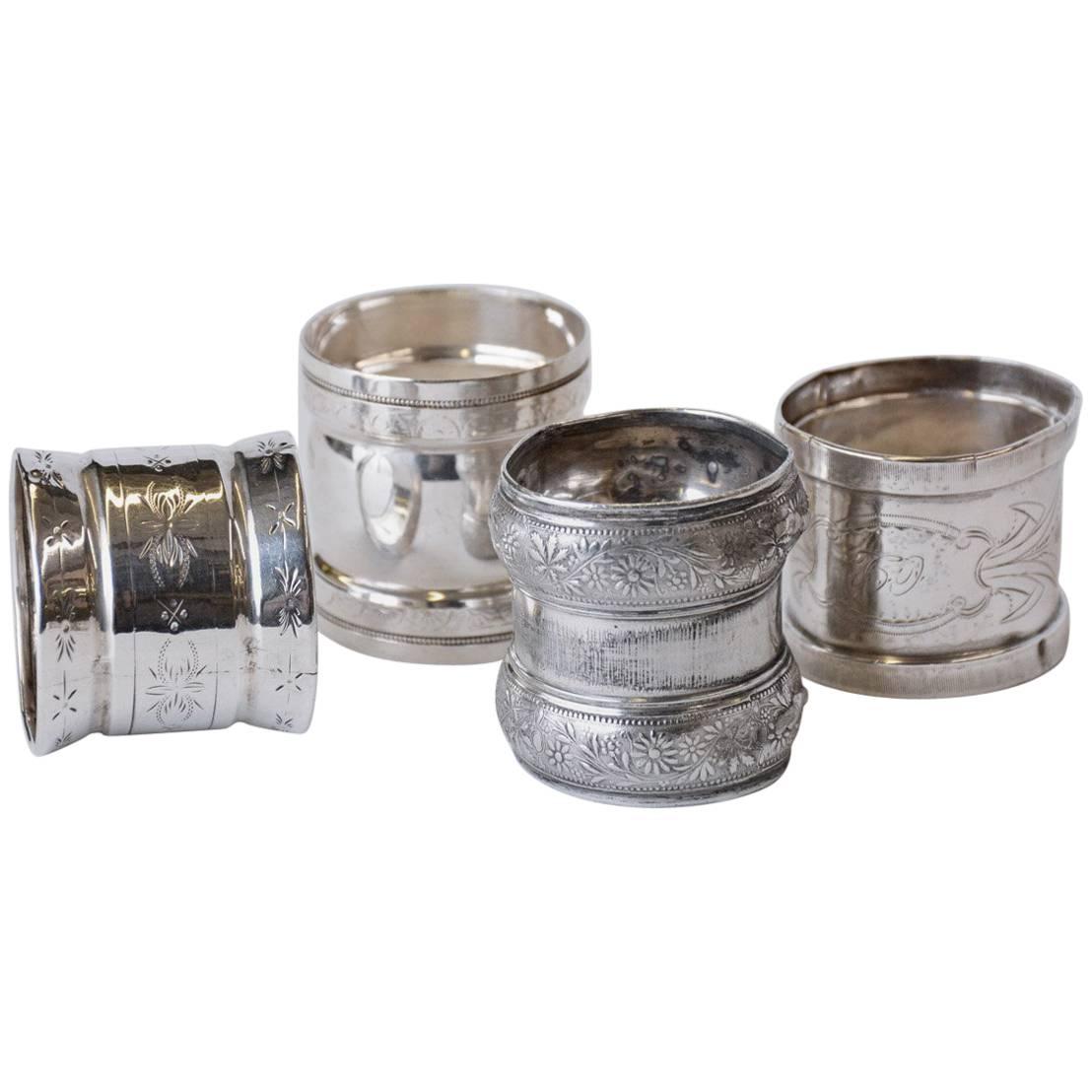 Four Late Victorian, Three Sterling and One Silver Plate Napkin Rings