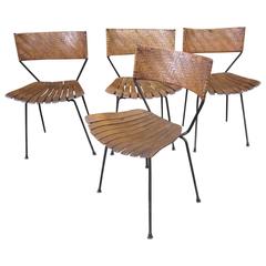 Four Iron Slat Chairs with Woven Backs in the Manner of Umanoff