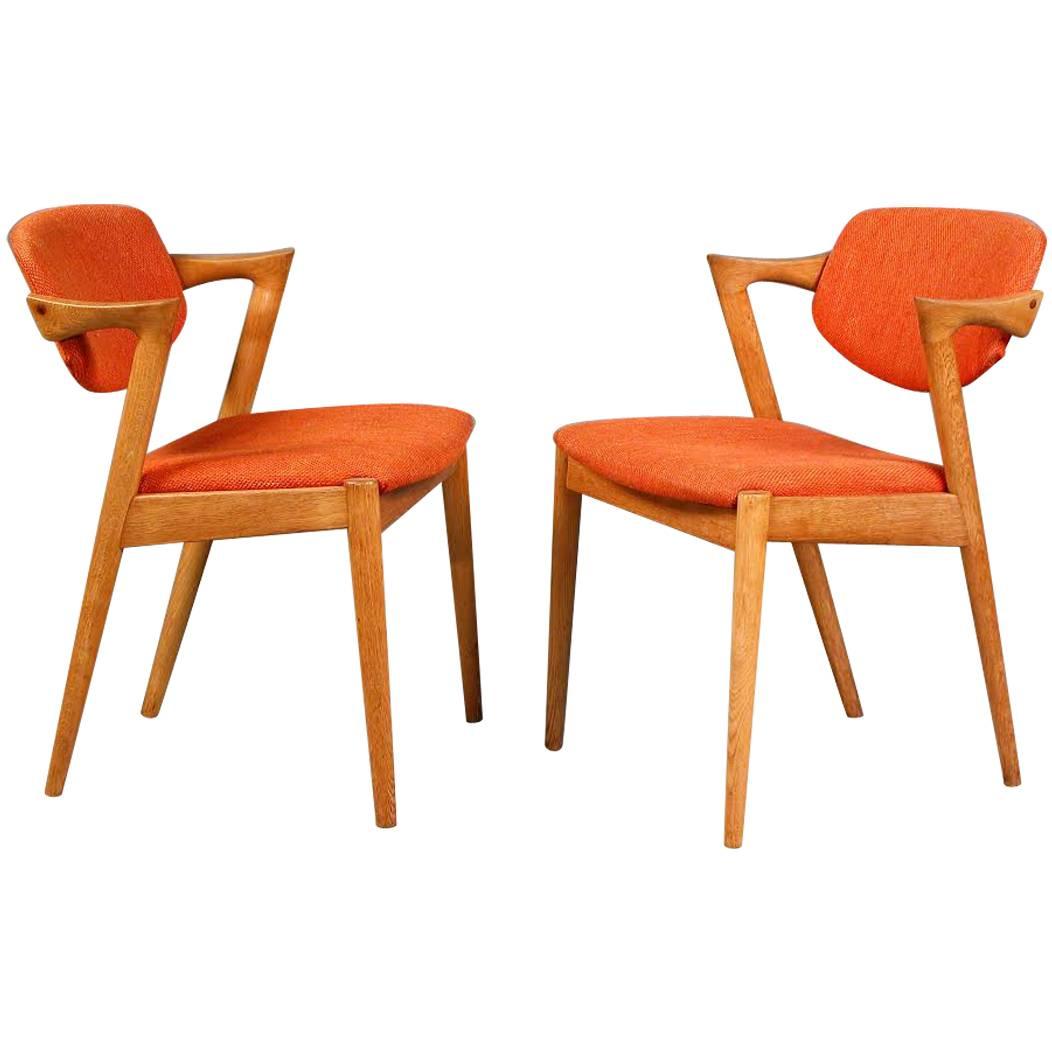 1960s Two Kai Kristiansen Model 42 Dining Chairs in Oak and Orange Fabric