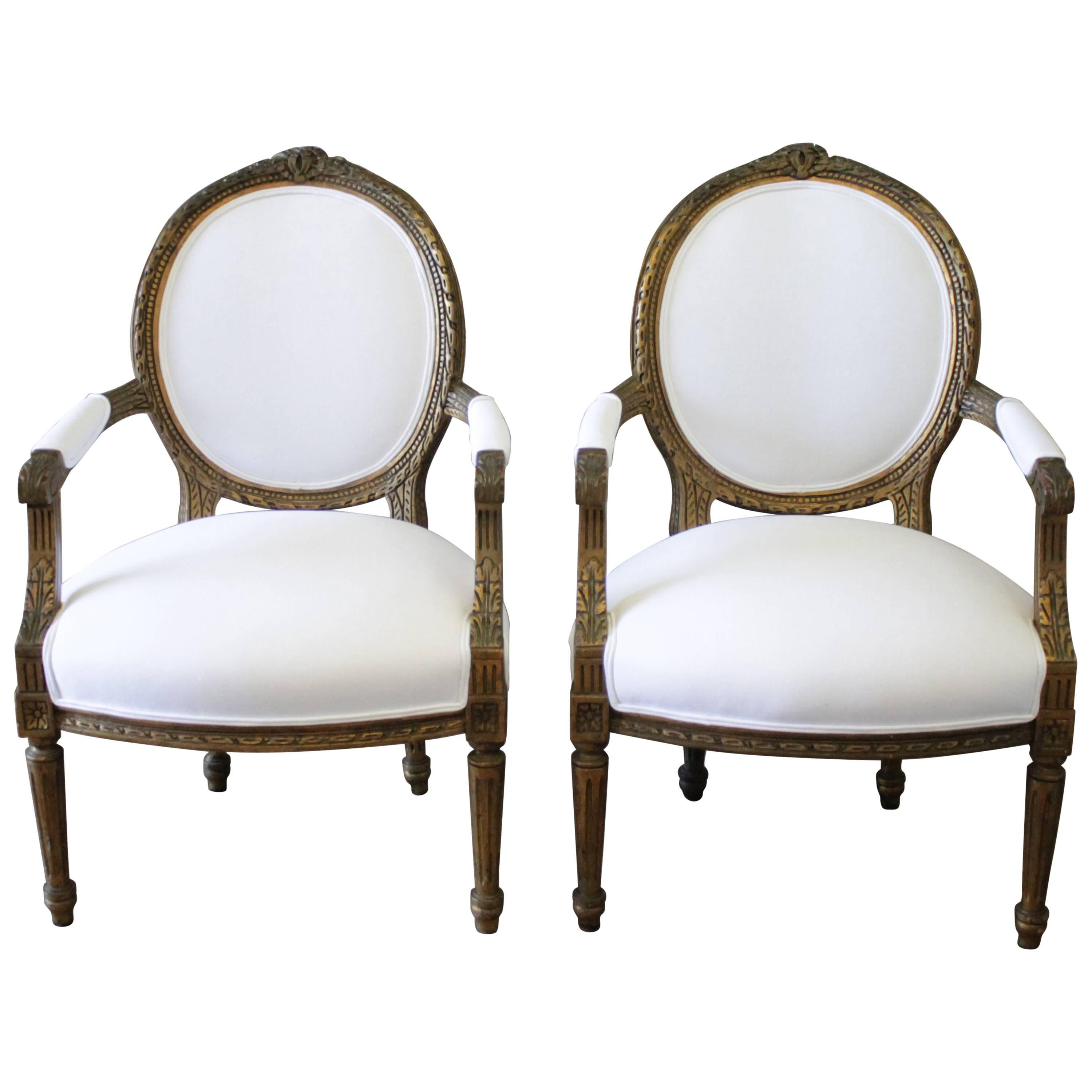 Pair of 19th Century Giltwood Ribbon Carved Louis XVI Style French Chairs