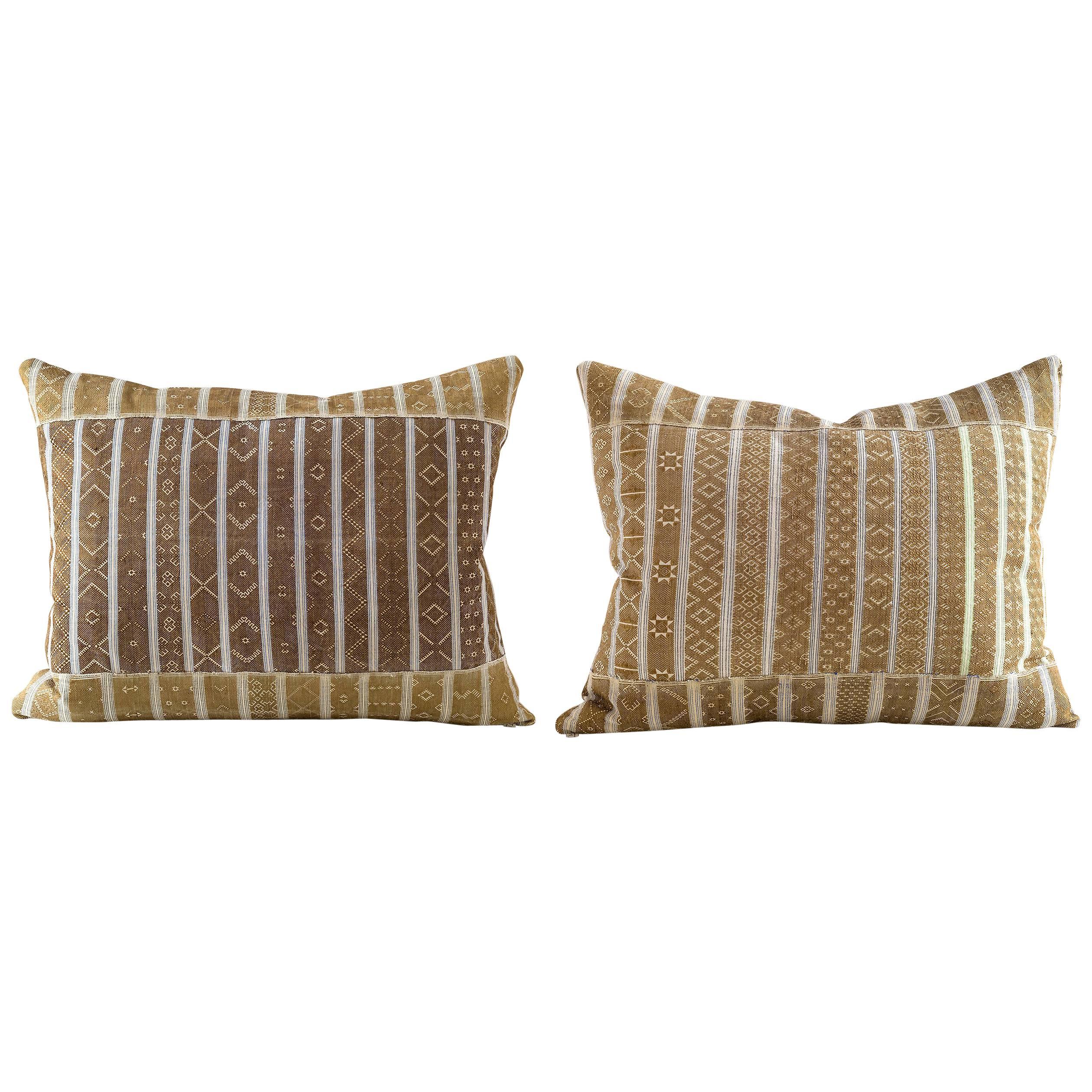 These pillows are made from vintage Miao scarves. They are narrow hand woven fabric in gold and cream colored geometric motifs from cotton and silk with muted lurex details in the fabric. 

Linen on reverse see image
75/25 goose feather and down
