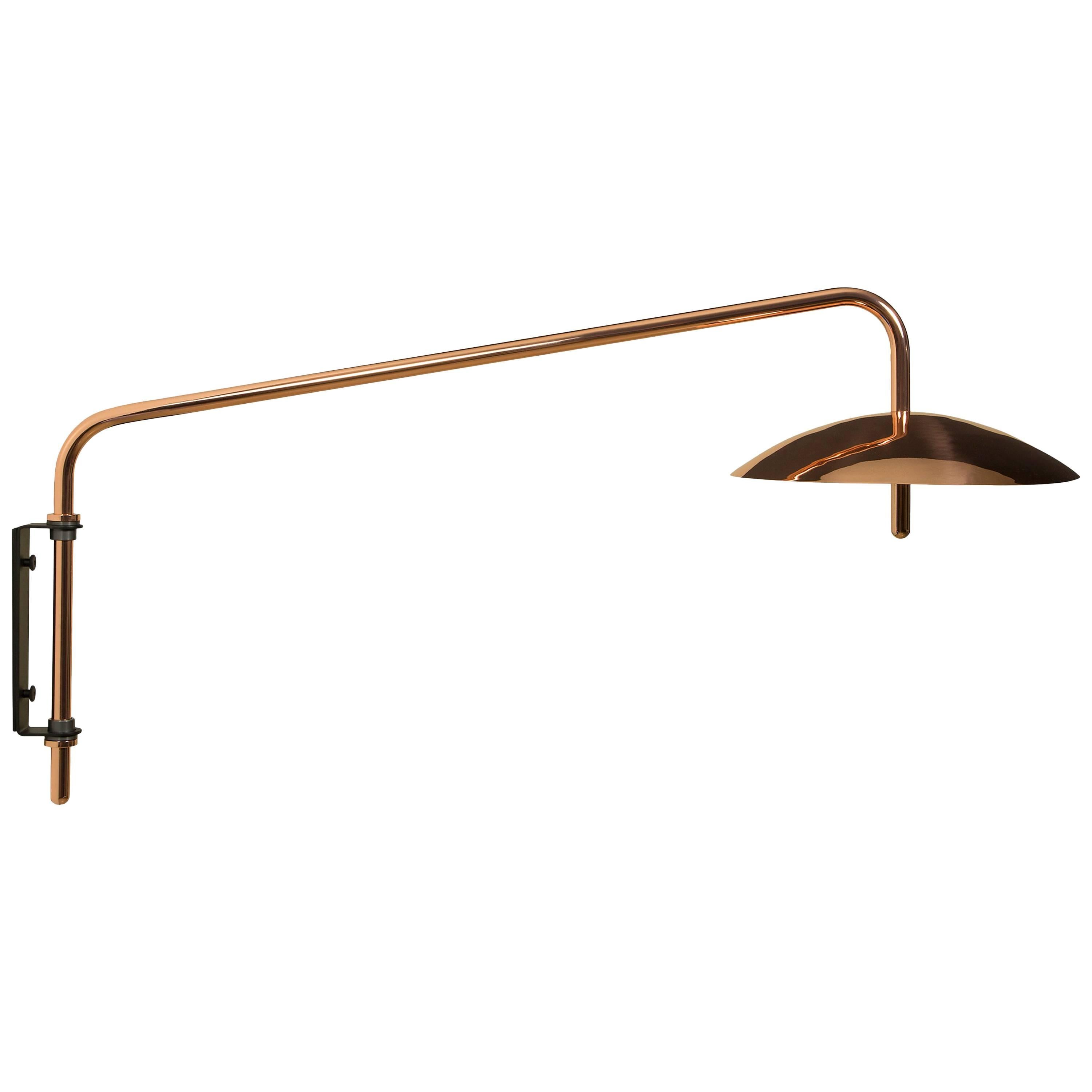 The Signal arm sconce is a rotatable sconce that seamlessly blend the Mid-Century Modern aesthetic with that of science fiction. A bent aluminum tube cantilevers from a wall-mounted bracket to allow the spun shade to hover above any interior. Clean,