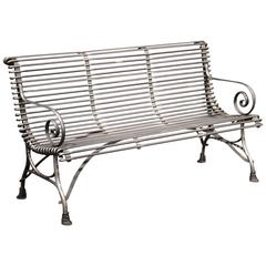 French Polished Iron Bench with Scrolled Arms and Hoof Feet Signed Sauveur Arras