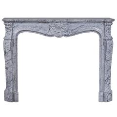 Antique Louis XV Style Fireplace, in Bleu Fleuri Marble, with Three Shells Decor