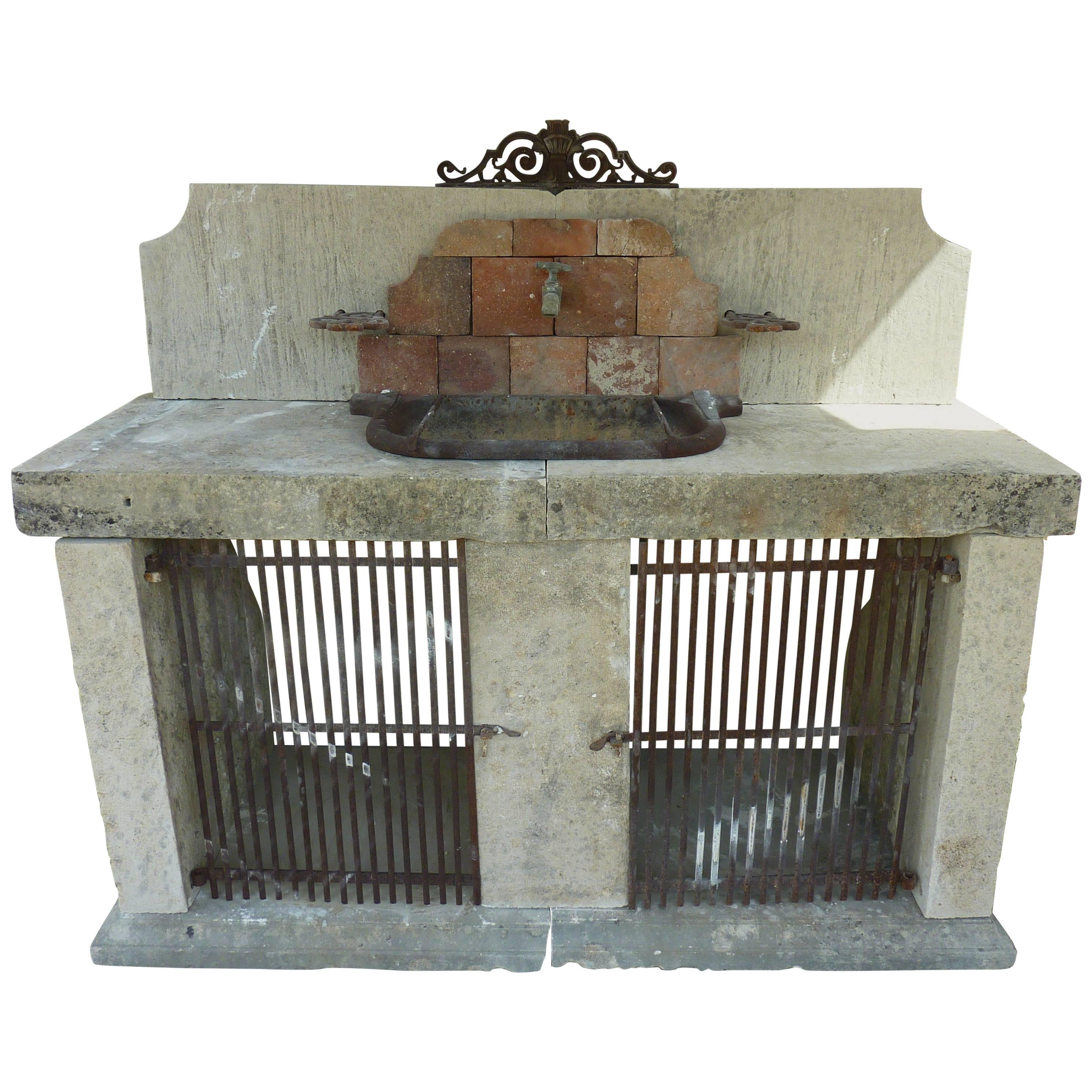 Summer Kitchen in Antique Materials with Wrought-Iron Sink and Terracotta Tiles