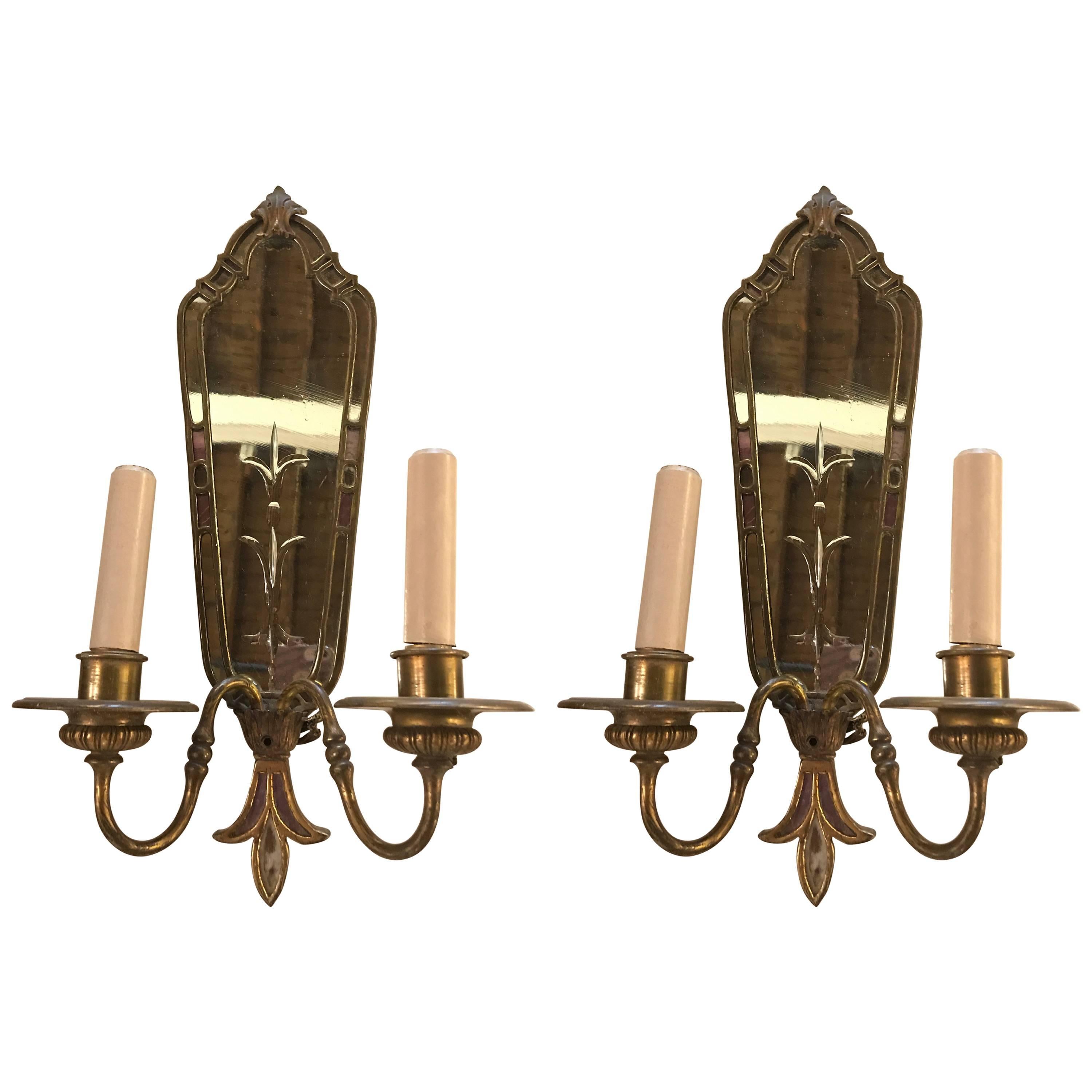 Pair of Two-Arm Bronze Antique Mirrored Back Sconces