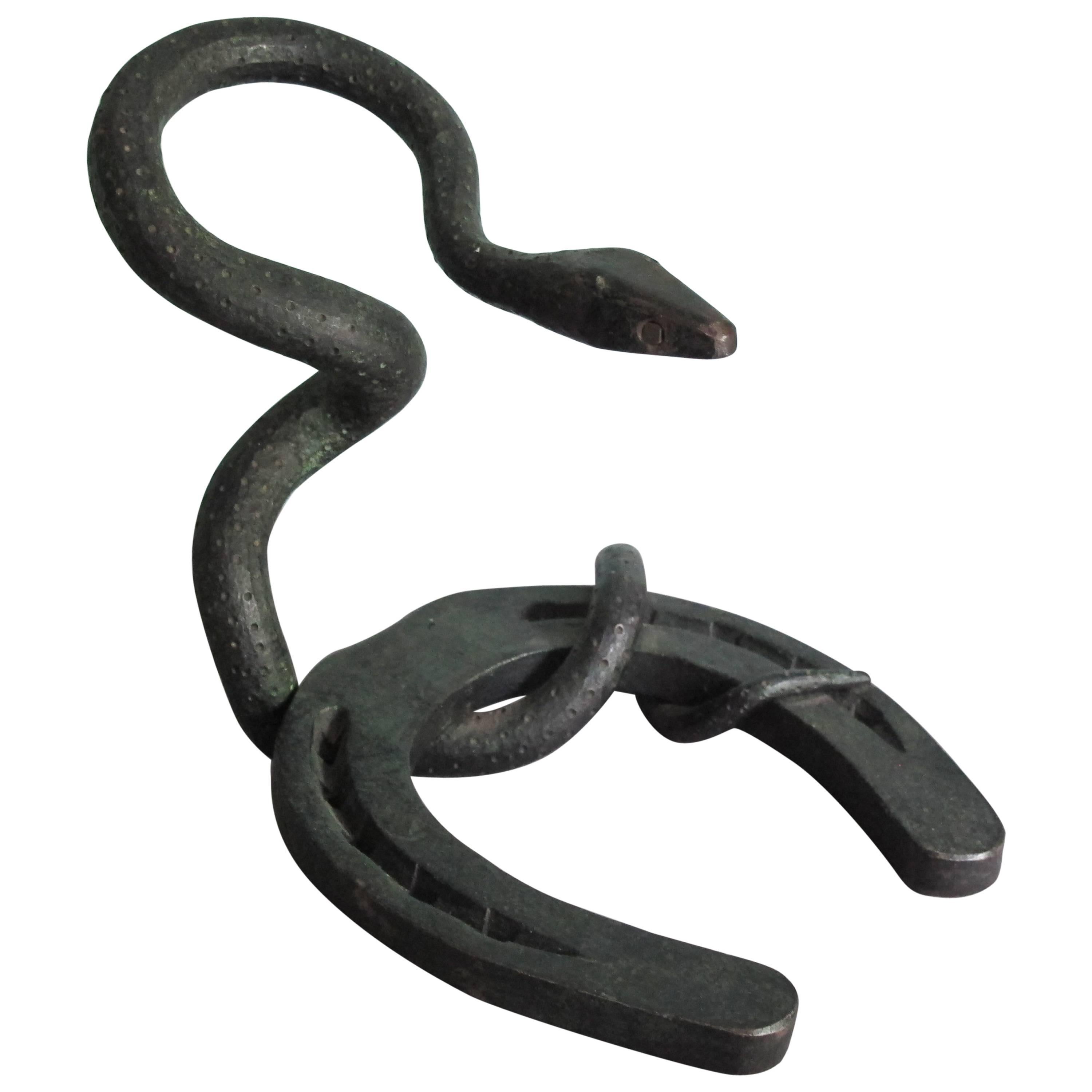 Forged Iron Snake and Horseshoe Intertwined For Sale