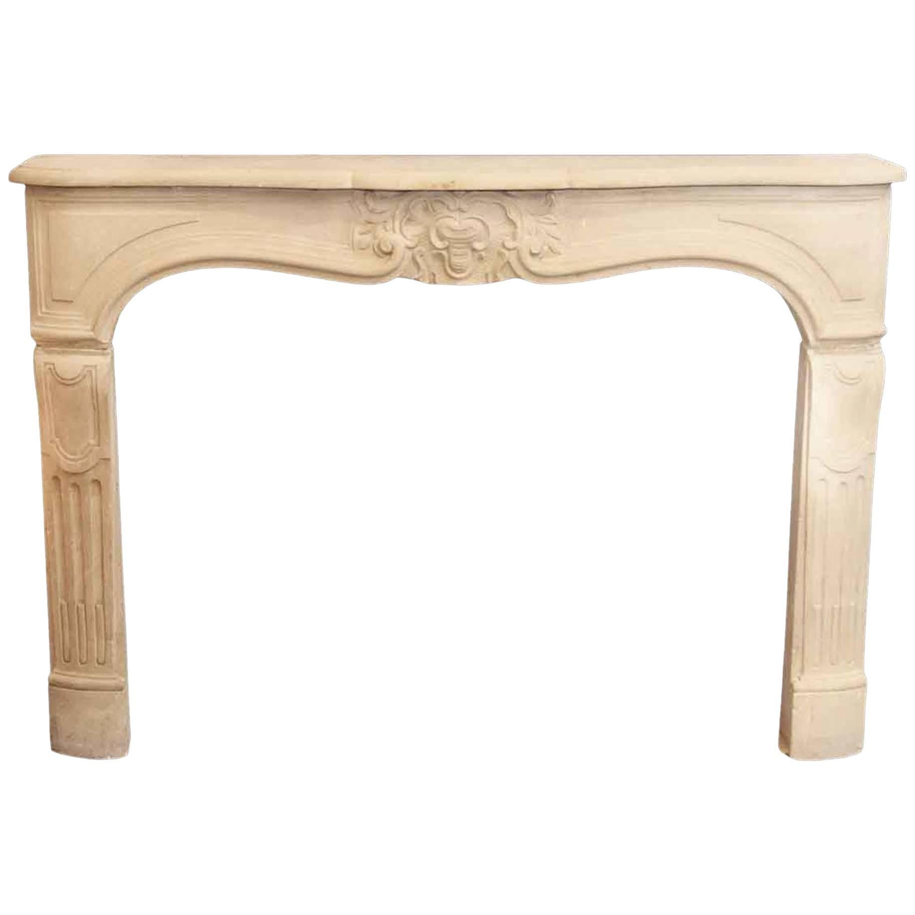 Tan Neoclassical Style Limestone Mantel with Carved Details