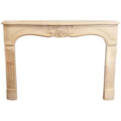 Tan Neoclassical Style Limestone Mantel with Carved Details