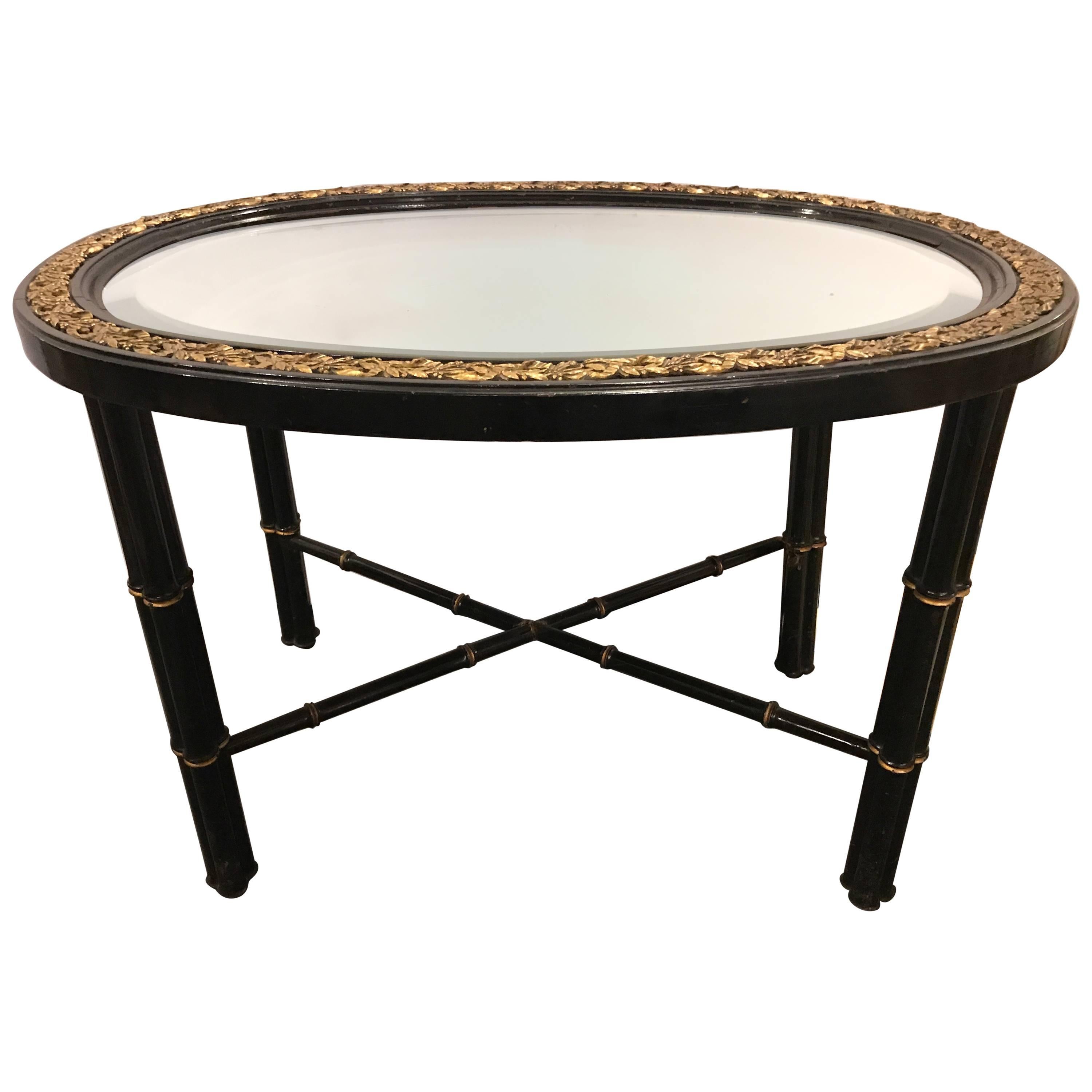 Hollywood Regency Beveled Mirror Top Black Oval Coffee Table with Bronze Mounts For Sale