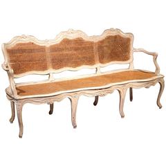 19th Century French Carved and Painted Louis XV Caned Settee