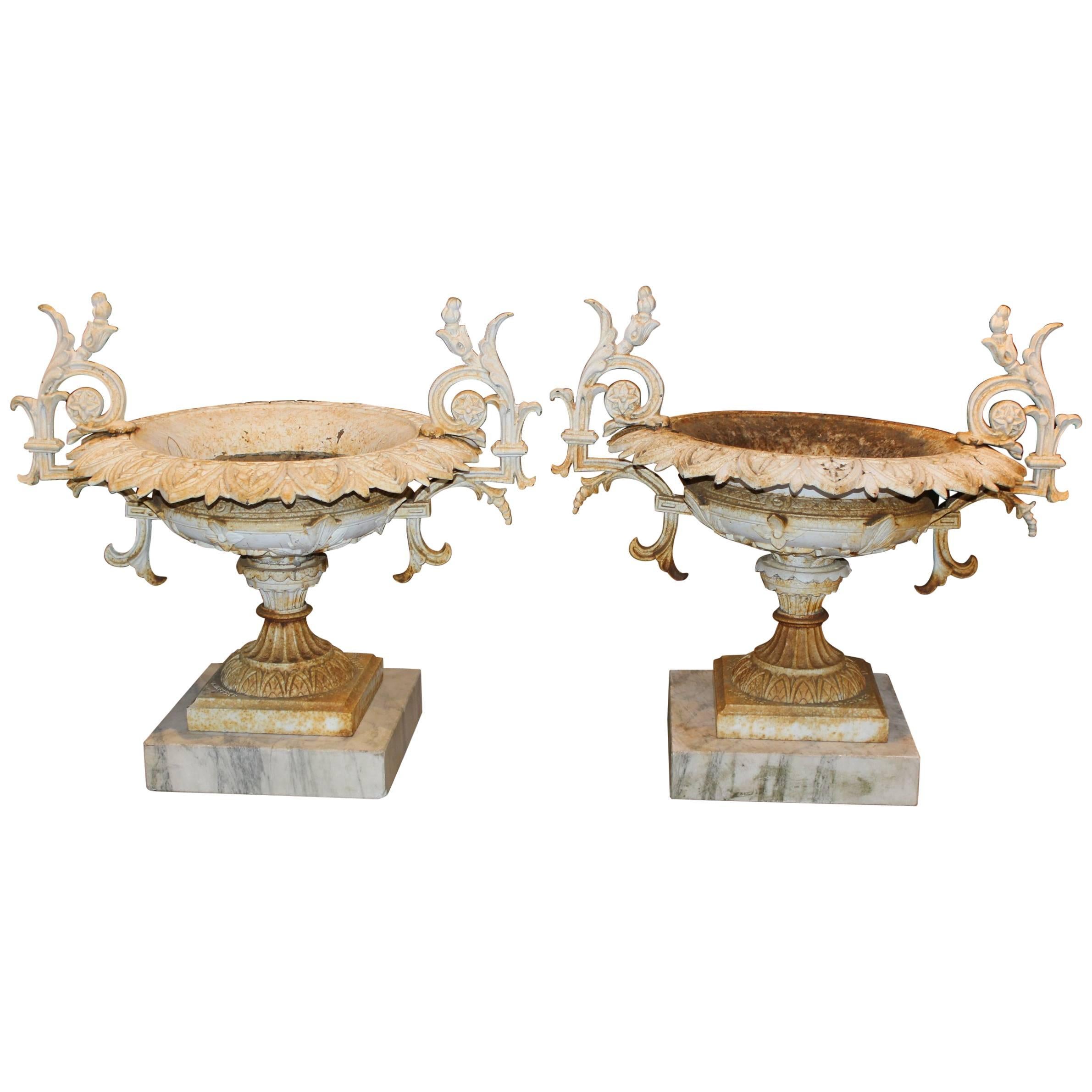 Pair of J.W. Fiske NY Signed Victorian Iron Urns on Marble Bases, circa 1874