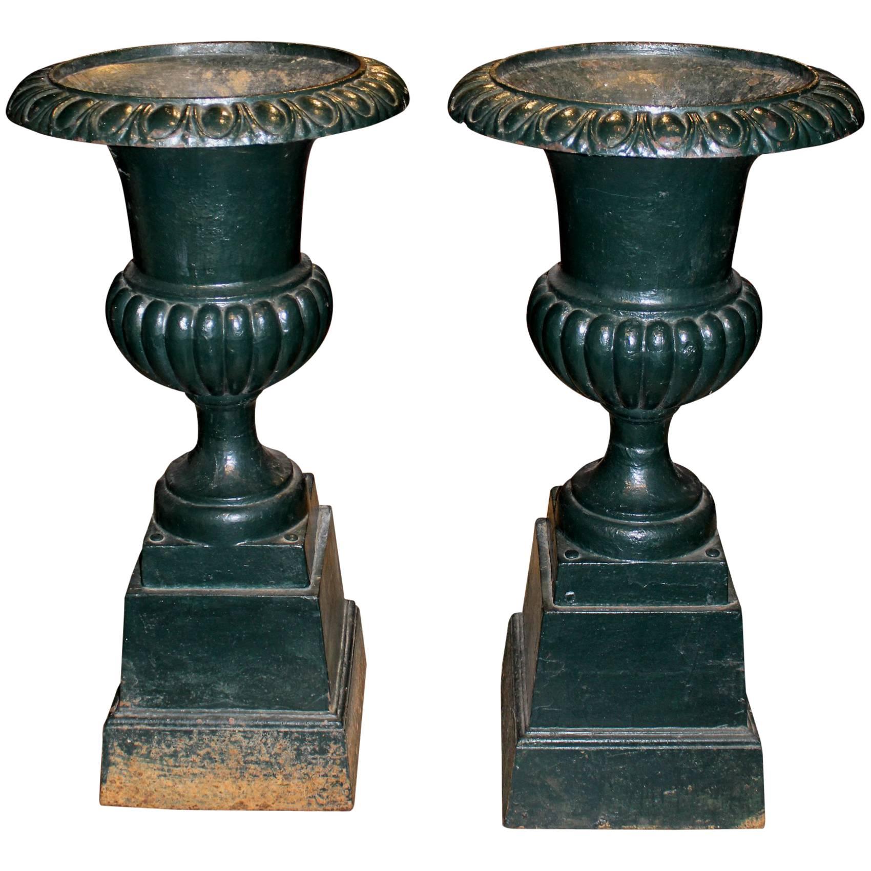 Pair of Green Painted Victorian Iron Urns on Attached Bases