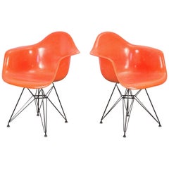 Pair of Orange Eames Armchair Shells
