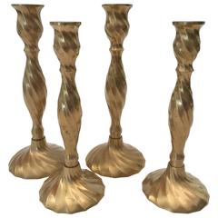 Four English Brass Swirl Base Candlesticks