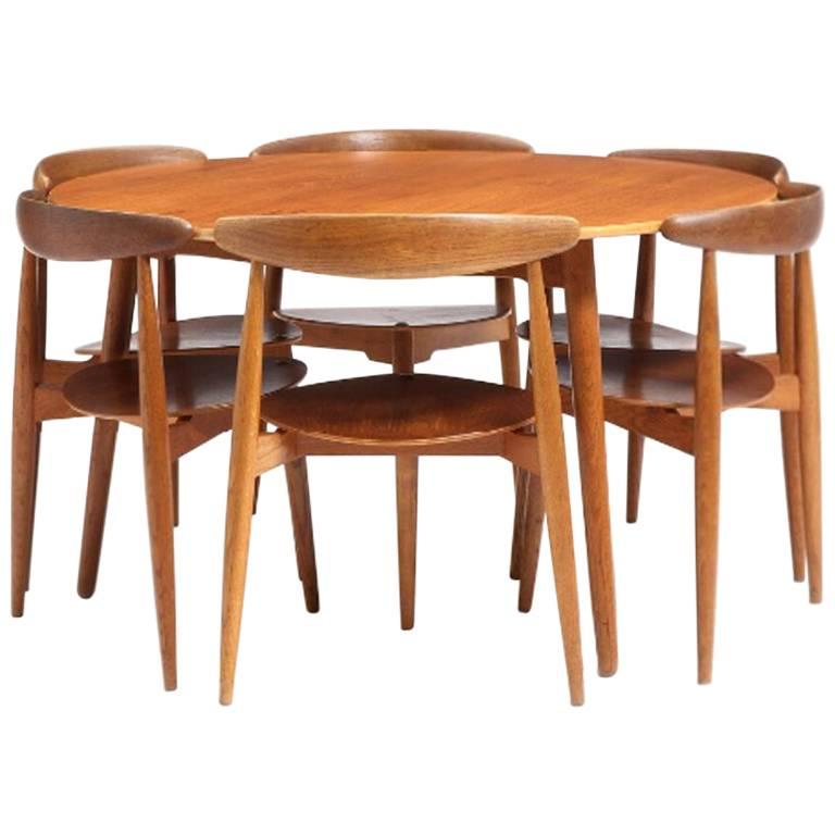 Hans Wegner 1950s round table and six heart chairs set in beech and teak  For Sale