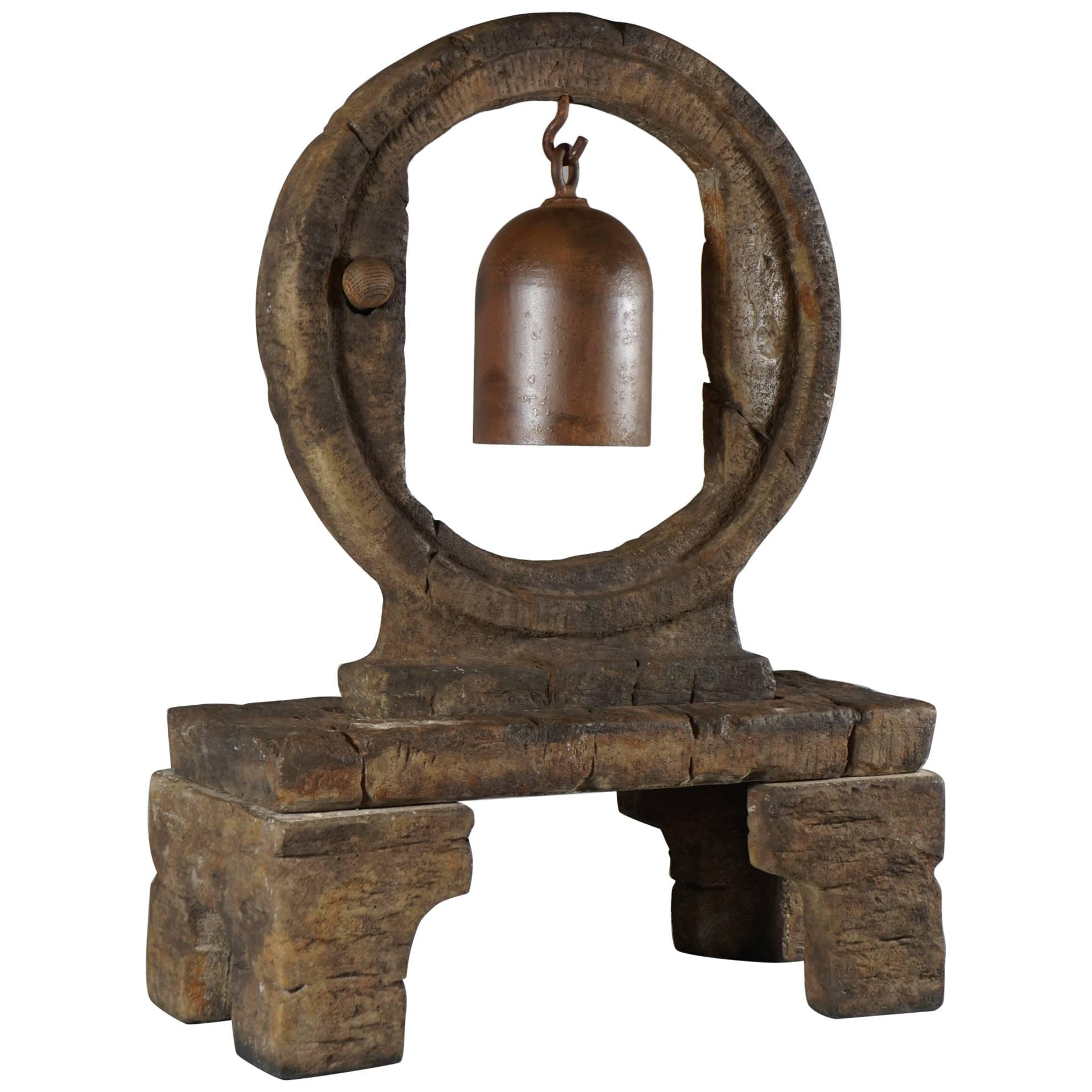 Resonant Iron Bell Suspended in Large Cast Stone Wheel on Stand