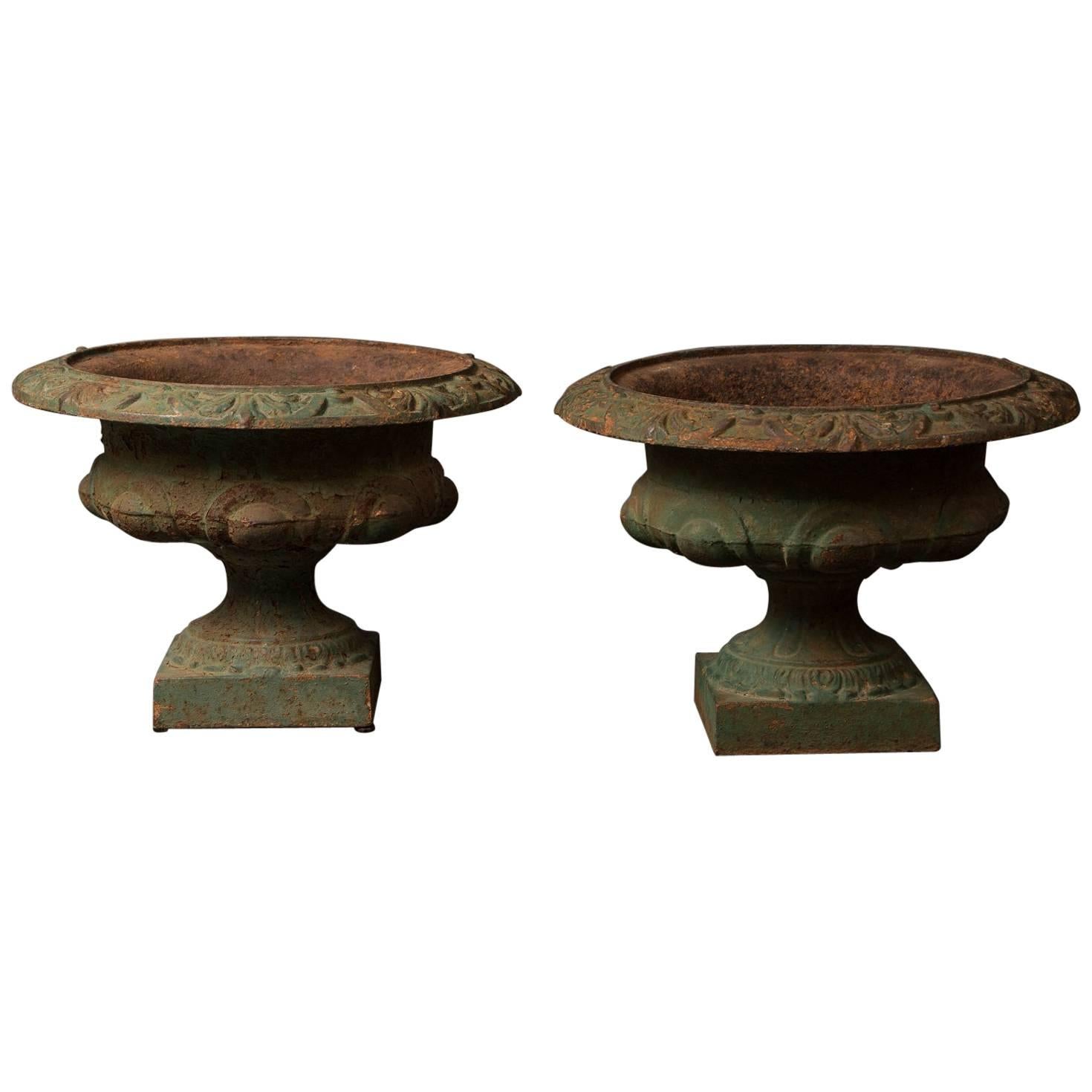 Pair of French Iron Urns For Sale