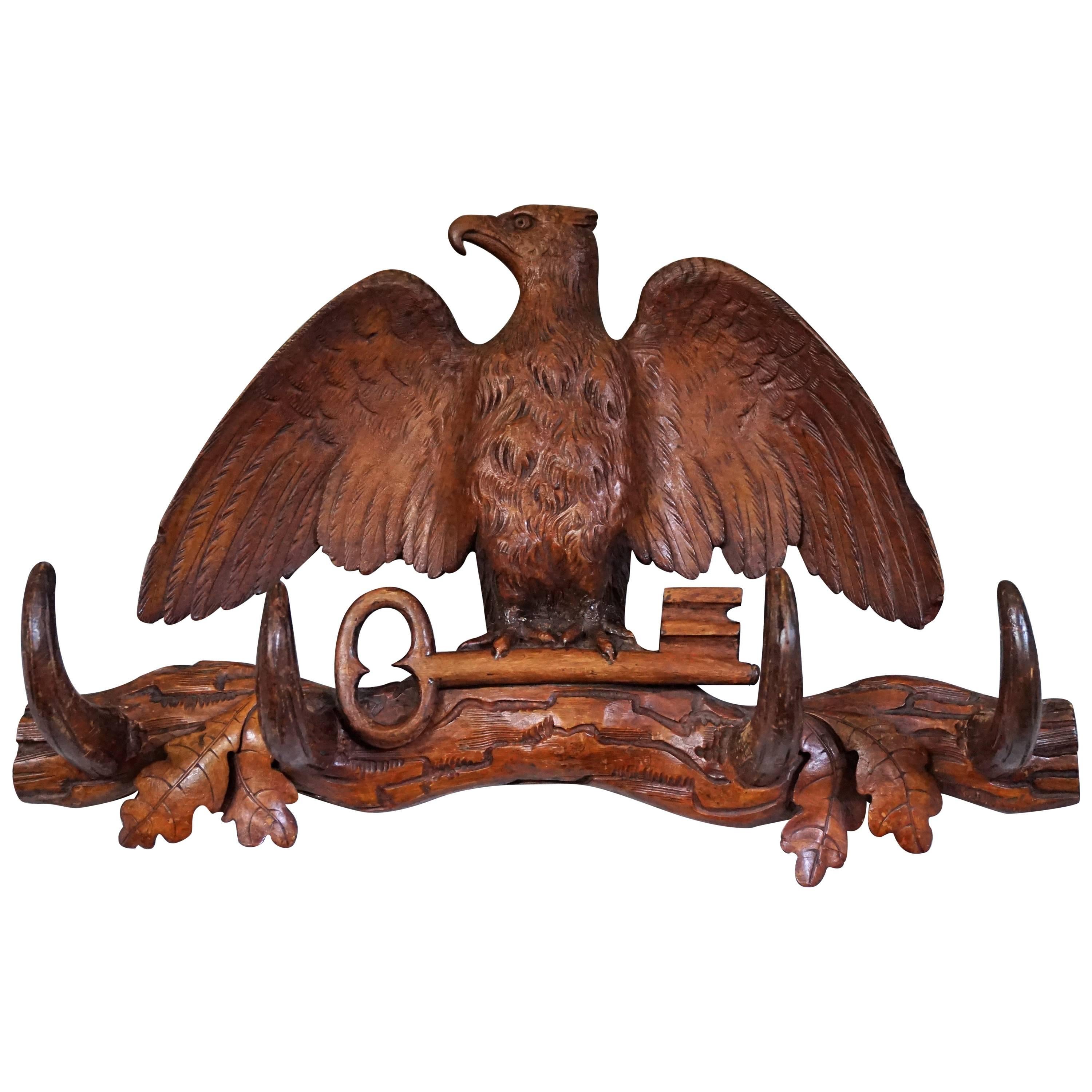 Antique Hand-Carved Small Black Forest Coat or Key Rack with Eagle Holding a Key