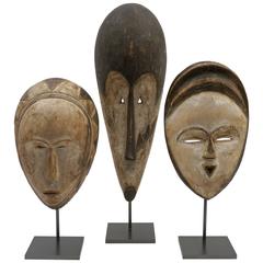 Set of Three African Hand-Carved and Painted Wood Masks on Metal Stands 12
