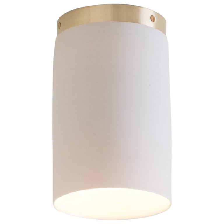 Surface, A Flush Mount Ceiling Light in White Porcelain and Brushed Brass For Sale
