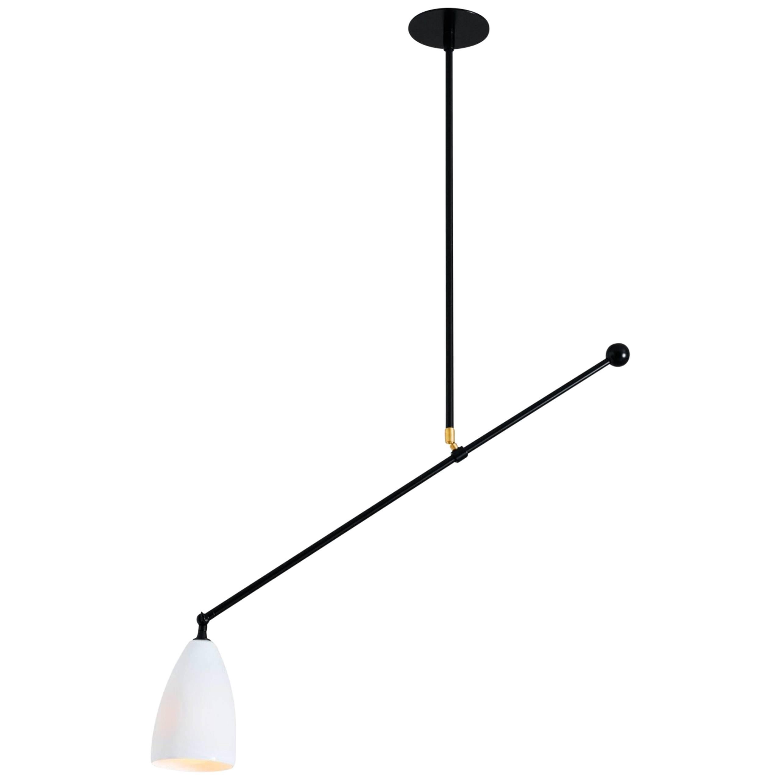 Slope, A Black Adjustable Task Light with White Glass Shade and Brass Details