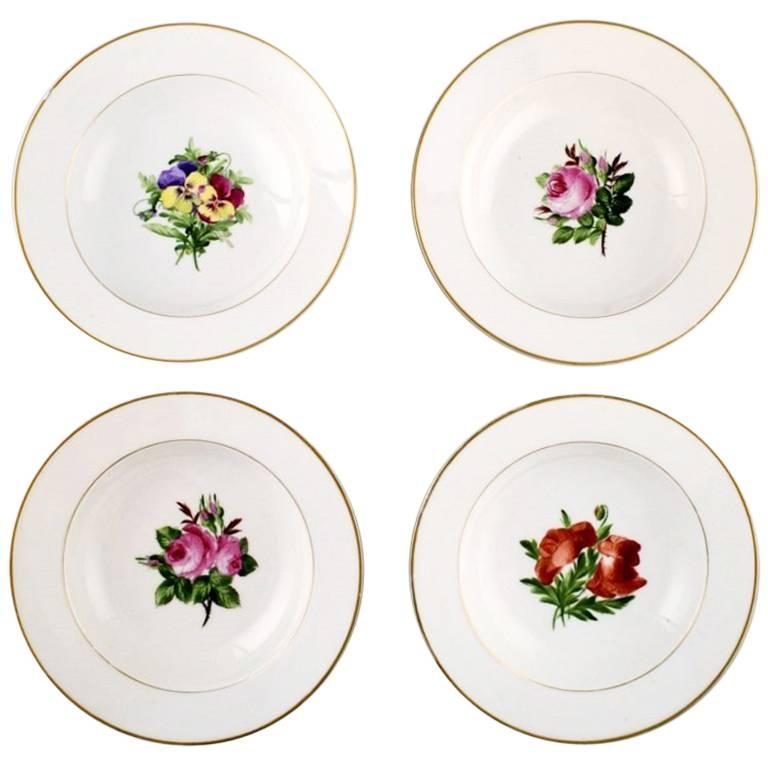 Four Antique Royal Copenhagen Deep Plates in Flora Danica Style For Sale