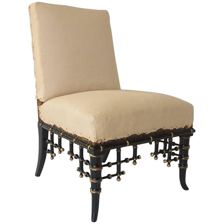 French ebonized and parcel-gilt faux-bamboo slipper chair, ca. 1860, offered by Acroterion