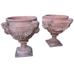 Pair of French Terra Cotta Colored Cast Stone Urns