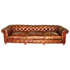 Used Pair of Monumental Distressed Leather Chesterfield Sofas. Priced Per Sofa.