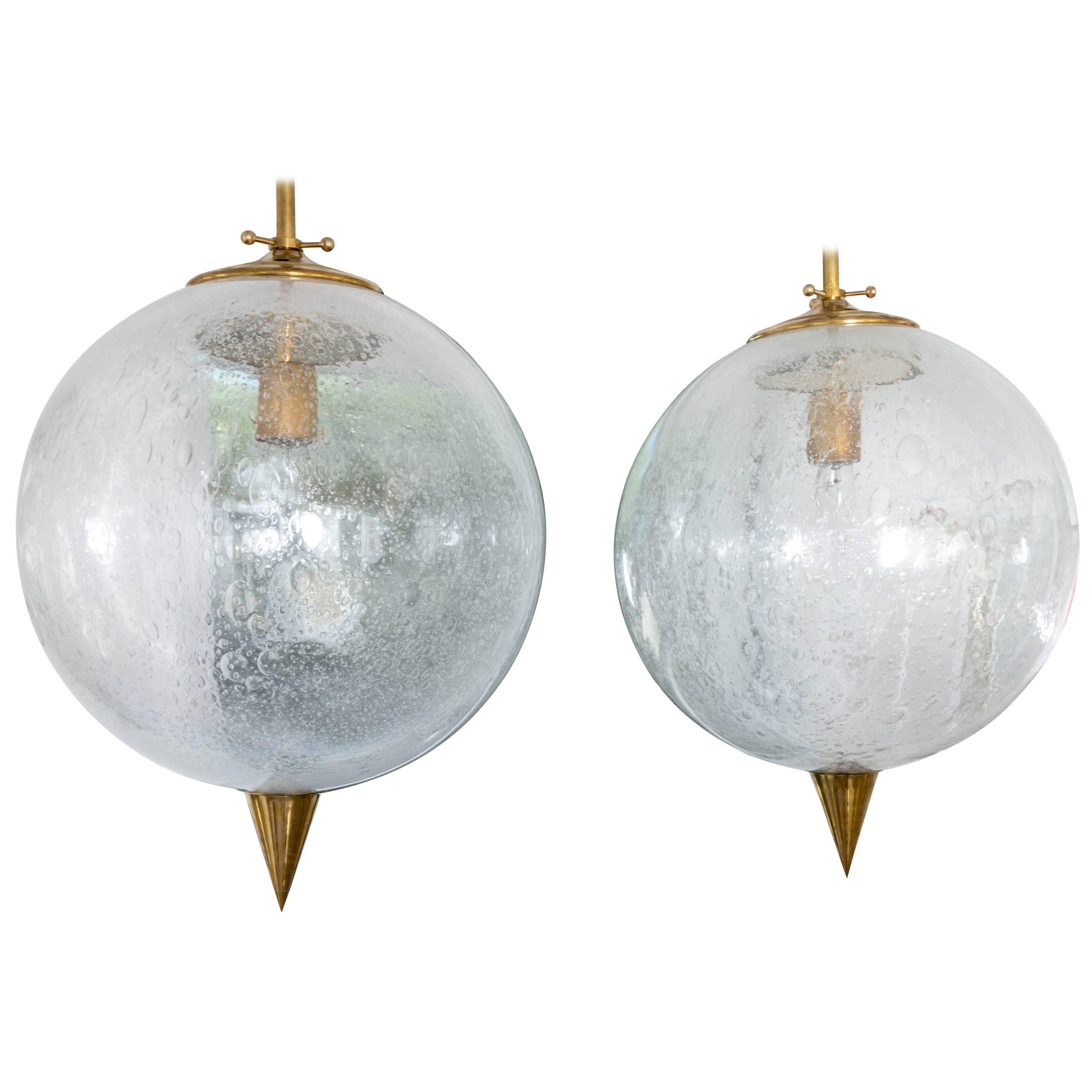 Spherical Clear Glass Pendant with Inclusive Air Bubbles and Brass Details For Sale