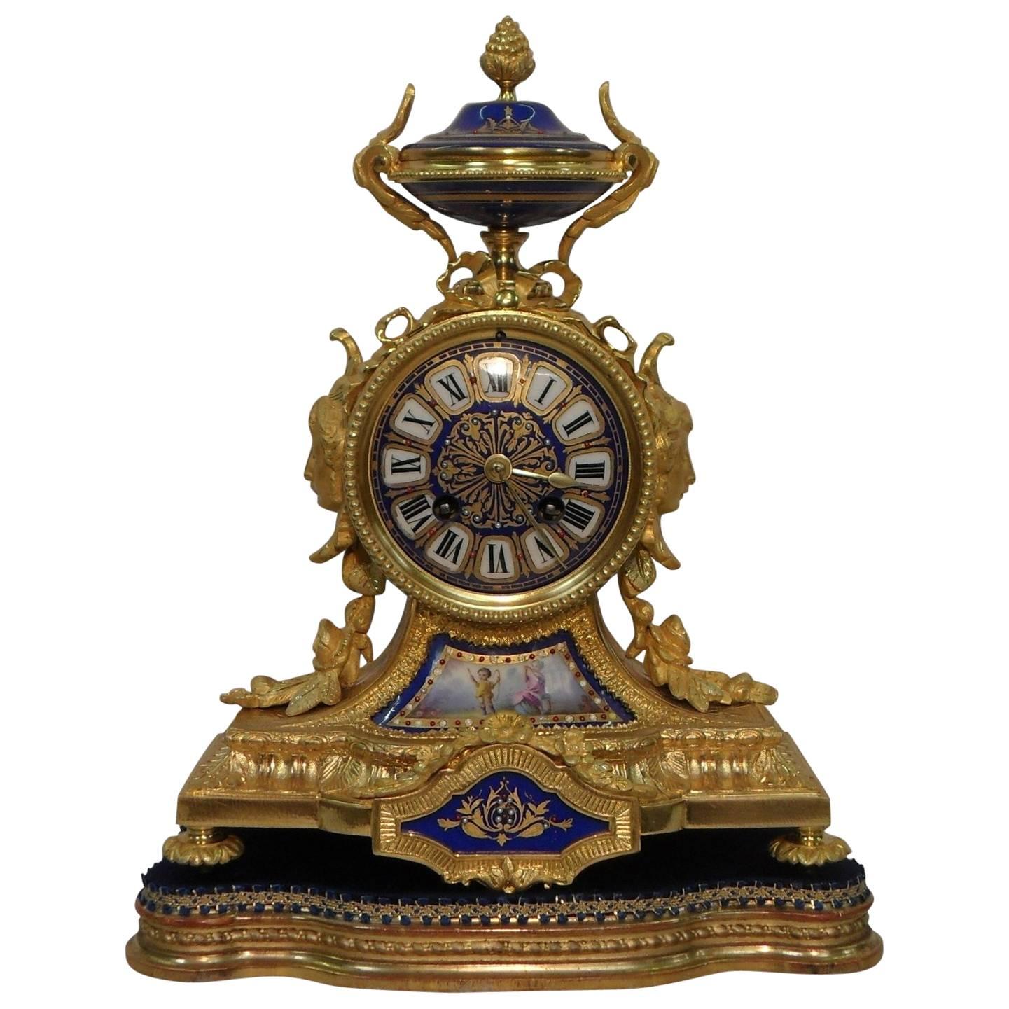 French 19th Century Bronze Gilt Mantel Clock with Serve Style Panels