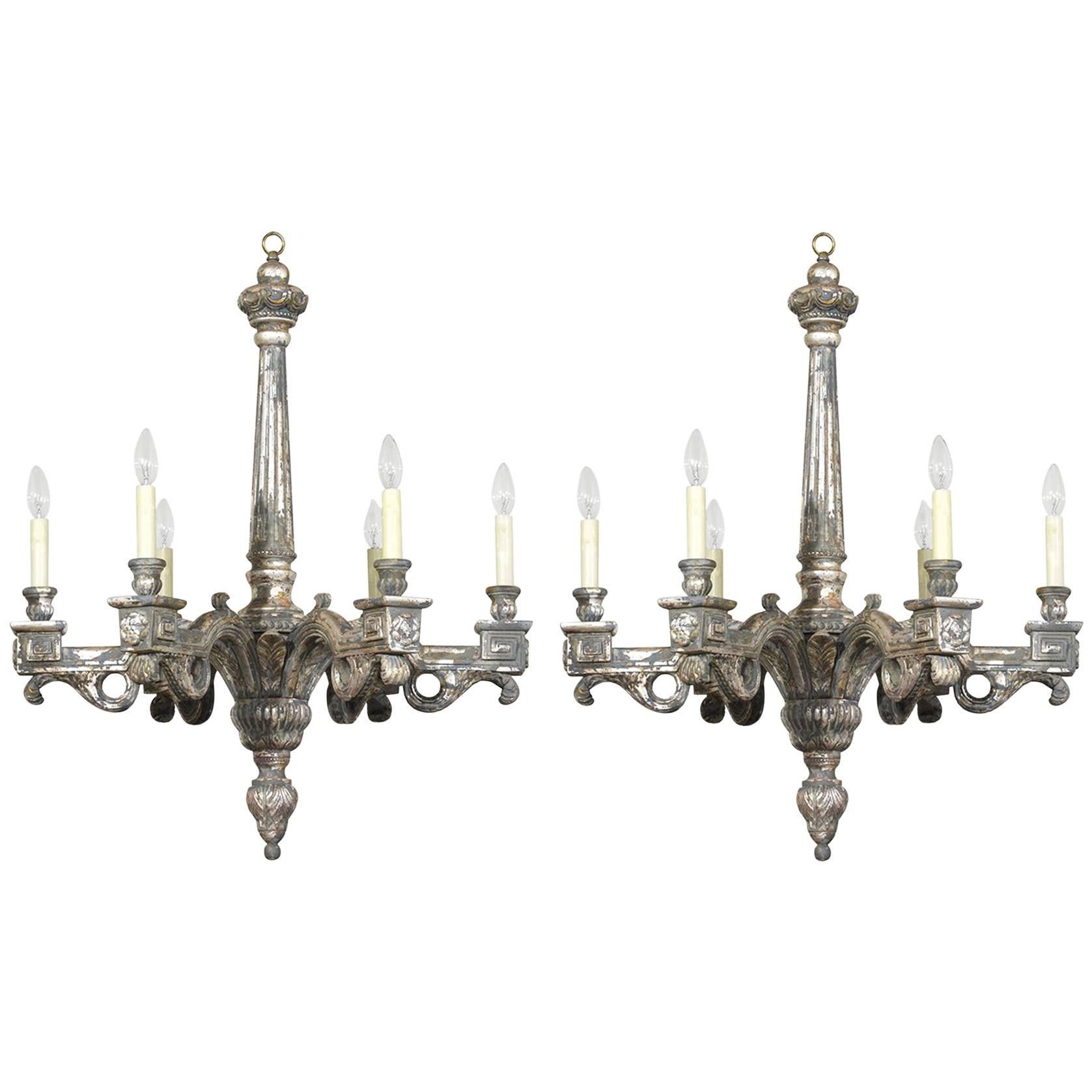 Pair of Six-Light Italian Neoclassical-Style Silver Leaf Carved Wood Chandeliers