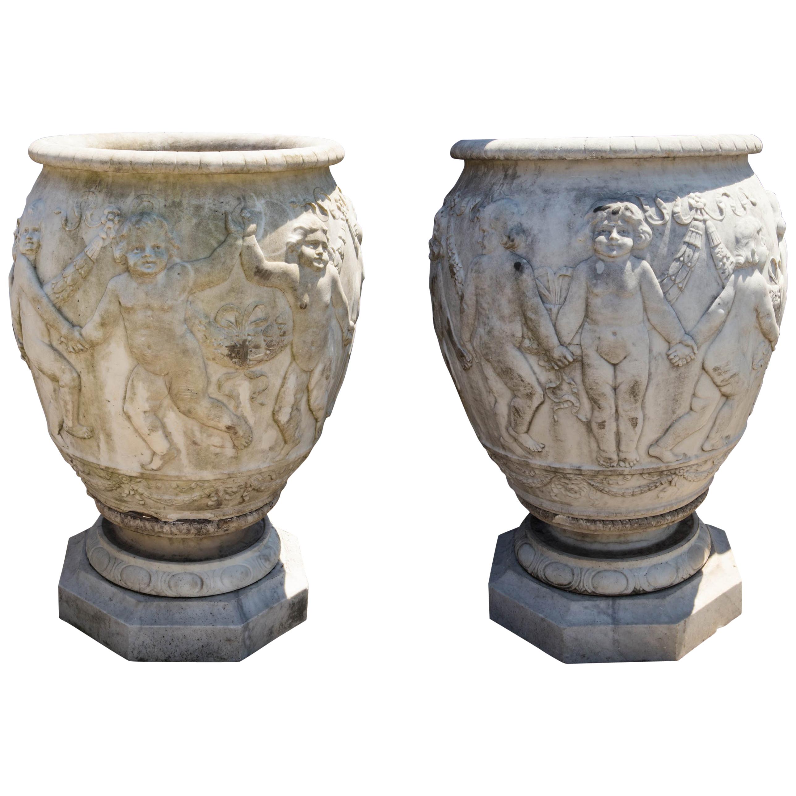 Pair of Large Antique Italian Marble Urns with Dancing Cherubs For Sale