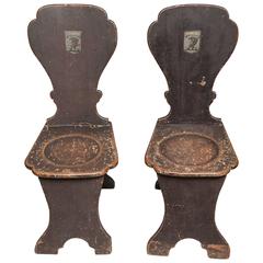 A pair of unusual 18th Century Painted Wood Hall Chairs, circa 1750