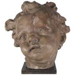 Terra Cotta Cherub Face on Steel Metal Base