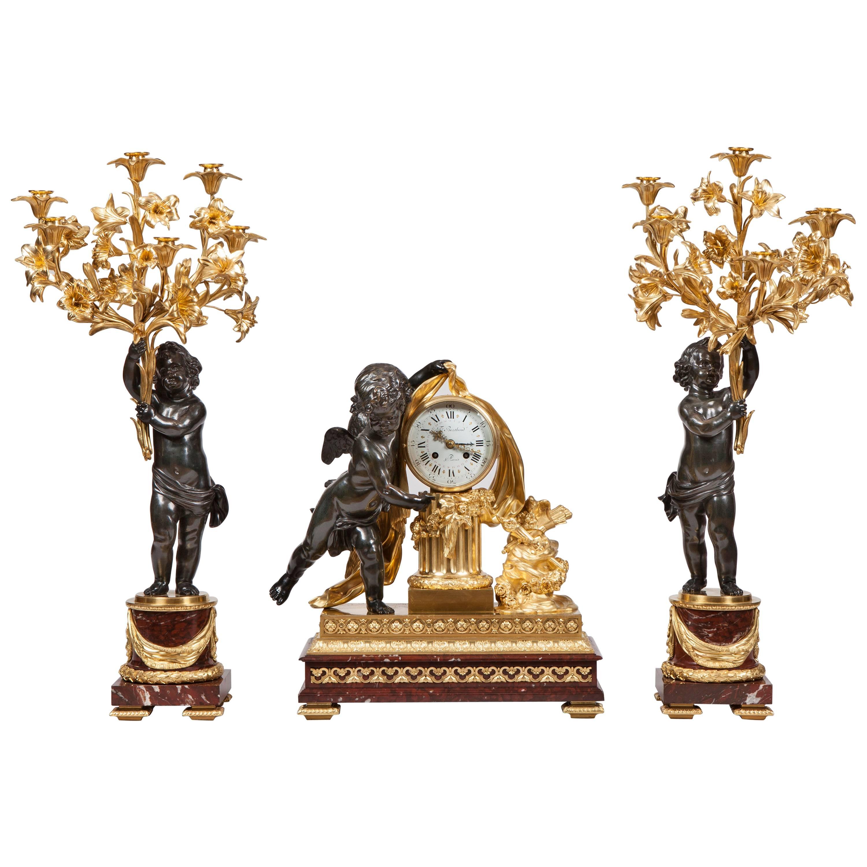French 19th Century Bronze and Ormolu Clock and Matching Candelabra