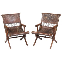 Fine Pair of Aesthetic Movement Walnut and Embossed and Gilt-Leather Armchairs