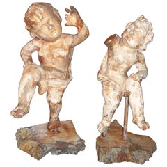 Pair of Carved and Giltwood Cherubs or Putti on Stand