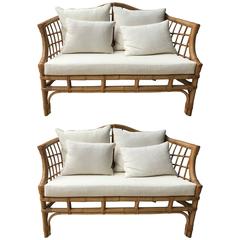 A pair of French Rattan sofas
