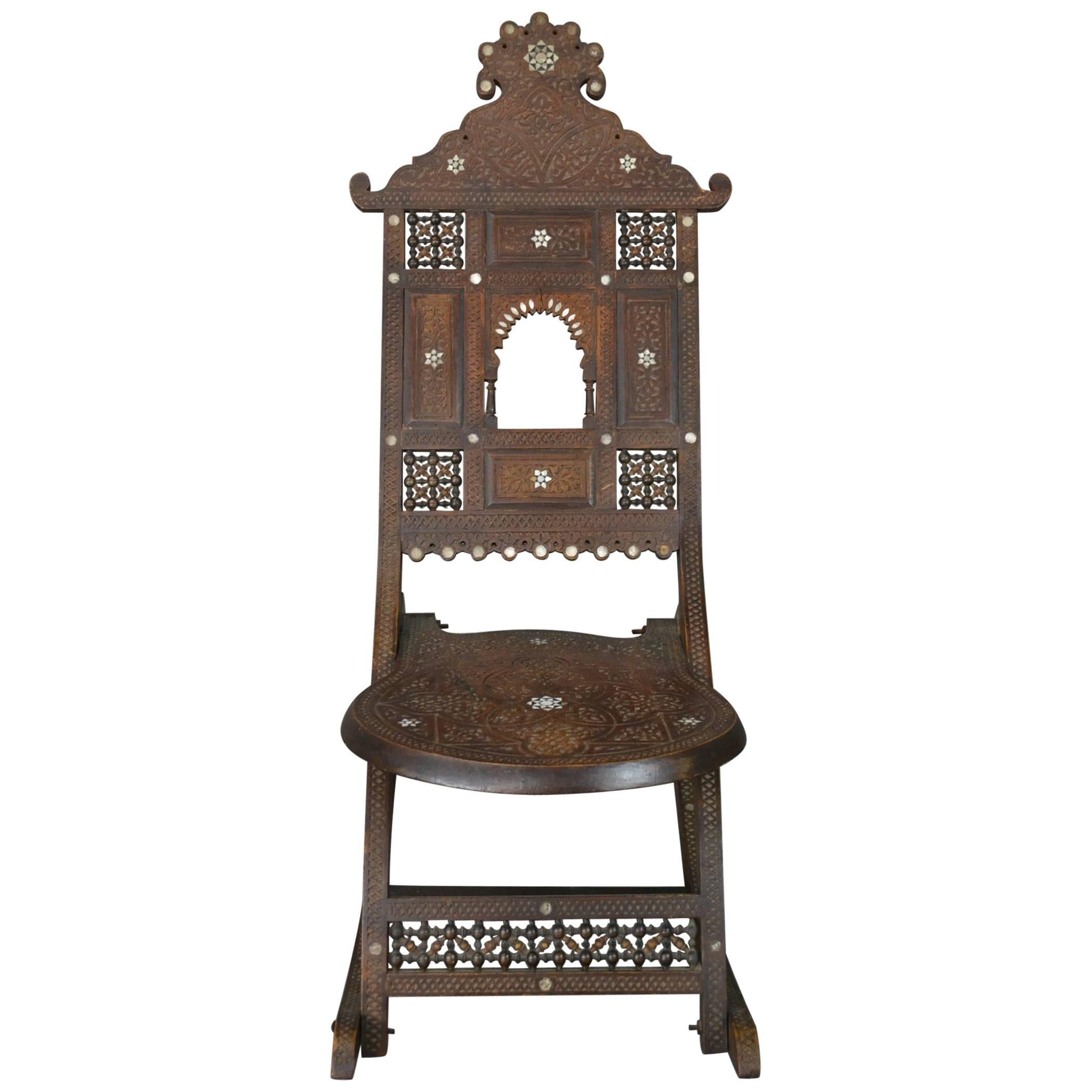 Early 20th Century Moorish Carved Teak and Inlaid Rocking Chair For Sale