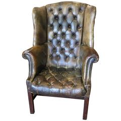 Antique Tufted Leather Wingback Chair with Mahogany Legs