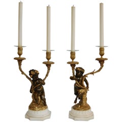 Pair of Gilt and Patinated Two-Light Candelabra, Signed "Clodion"