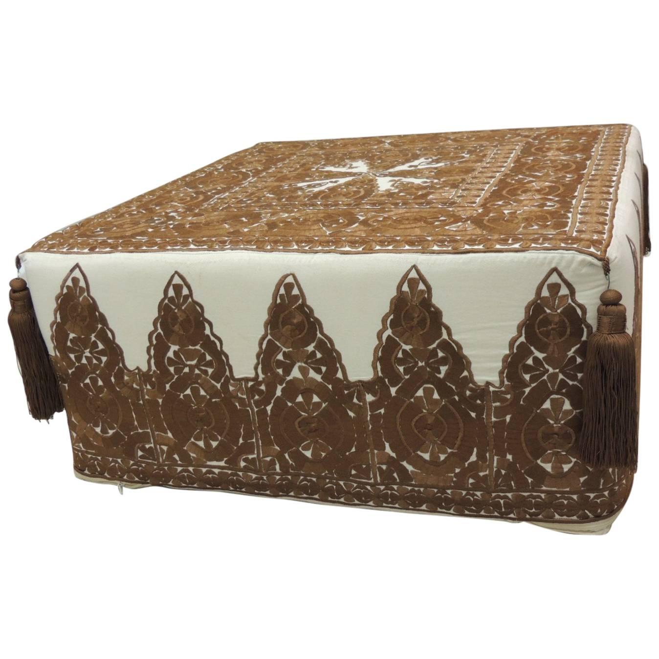 Offered by the Antique Textiles Galleries:
Modern Moroccan brown embroidered ottoman with tassels
Brown modern Moroccan embroidered pouf/ottoman with tassels. Square ottoman textile handmade and embroidered in Morocco. Floss silk threads embroidered