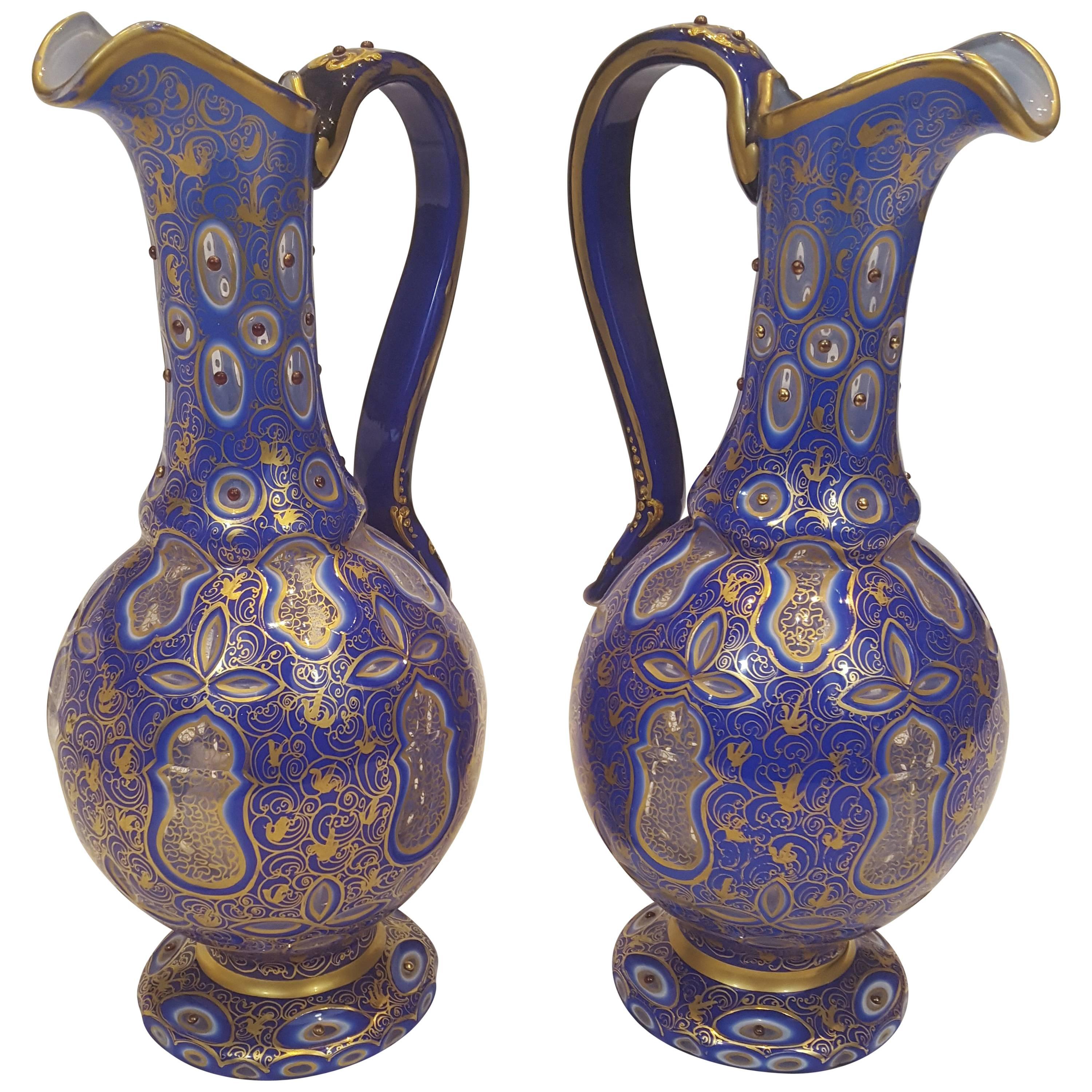 Pair of 19th Century Bohemian White and Blue-Overlay Gilt Glass Ewers For Sale