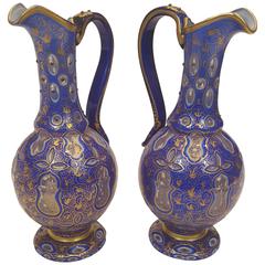 Pair of 19th Century Bohemian White and Blue-Overlay Gilt Glass Ewers