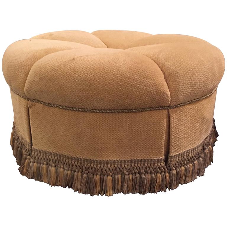 Circular Finely Upholstered and Lined Ottoman or Poof with a Tassel